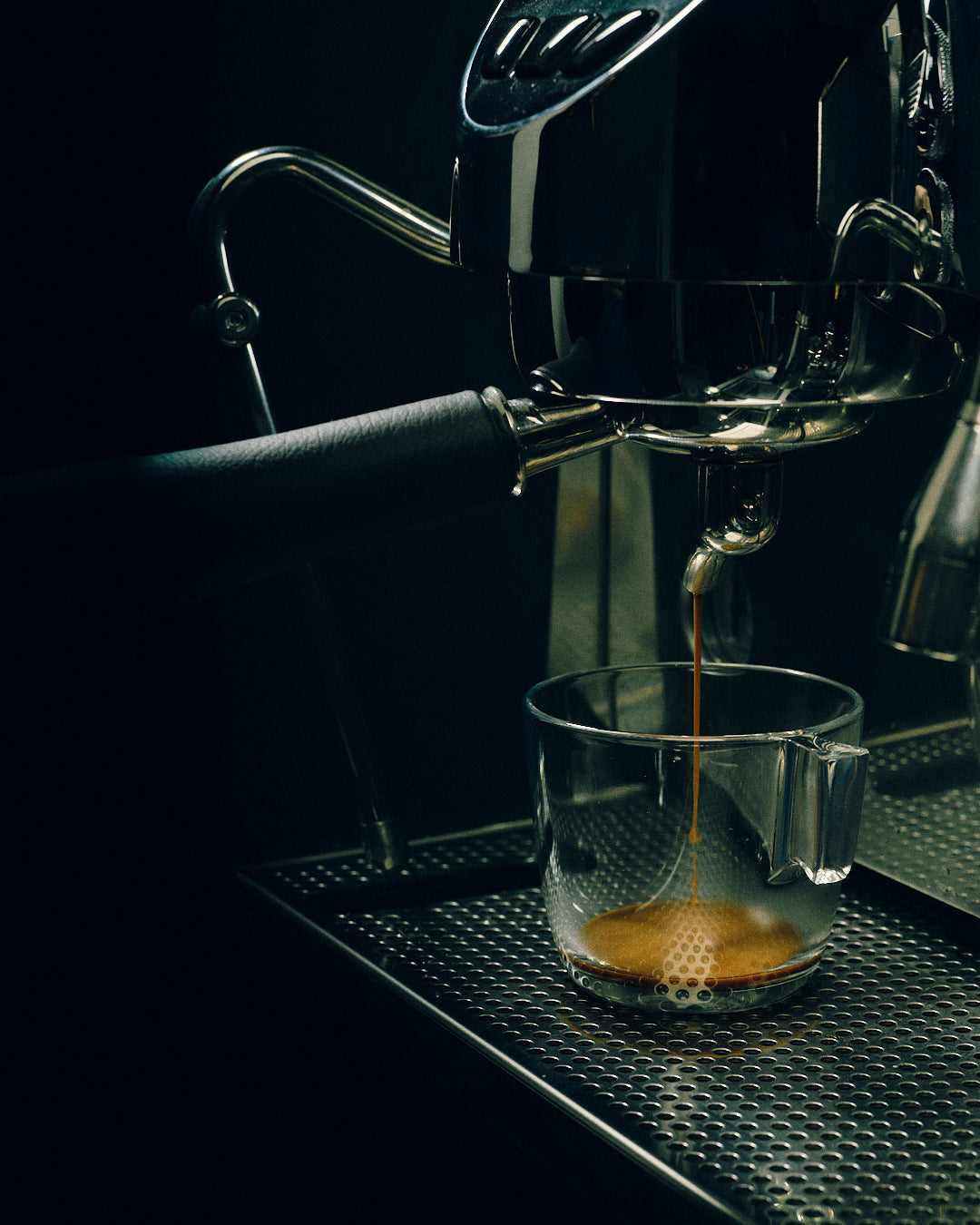 coffee machine pouring coffee in a glass