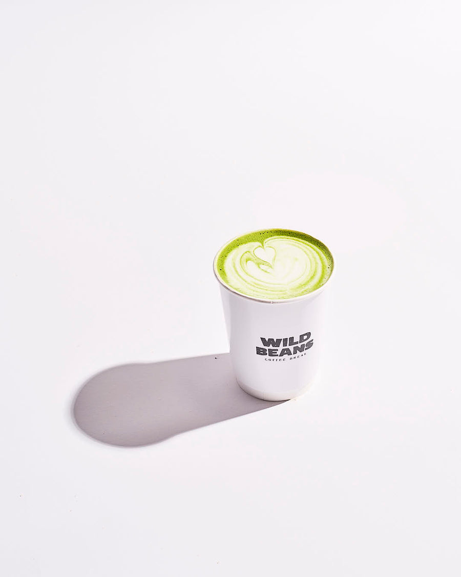 wild beans cup with a matcha dirnk and latte art